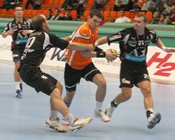 Schlinger (left) trying to stop the Zurich player
