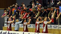 The players of Oltchim celebrate with their fans after the victory in Vienna.